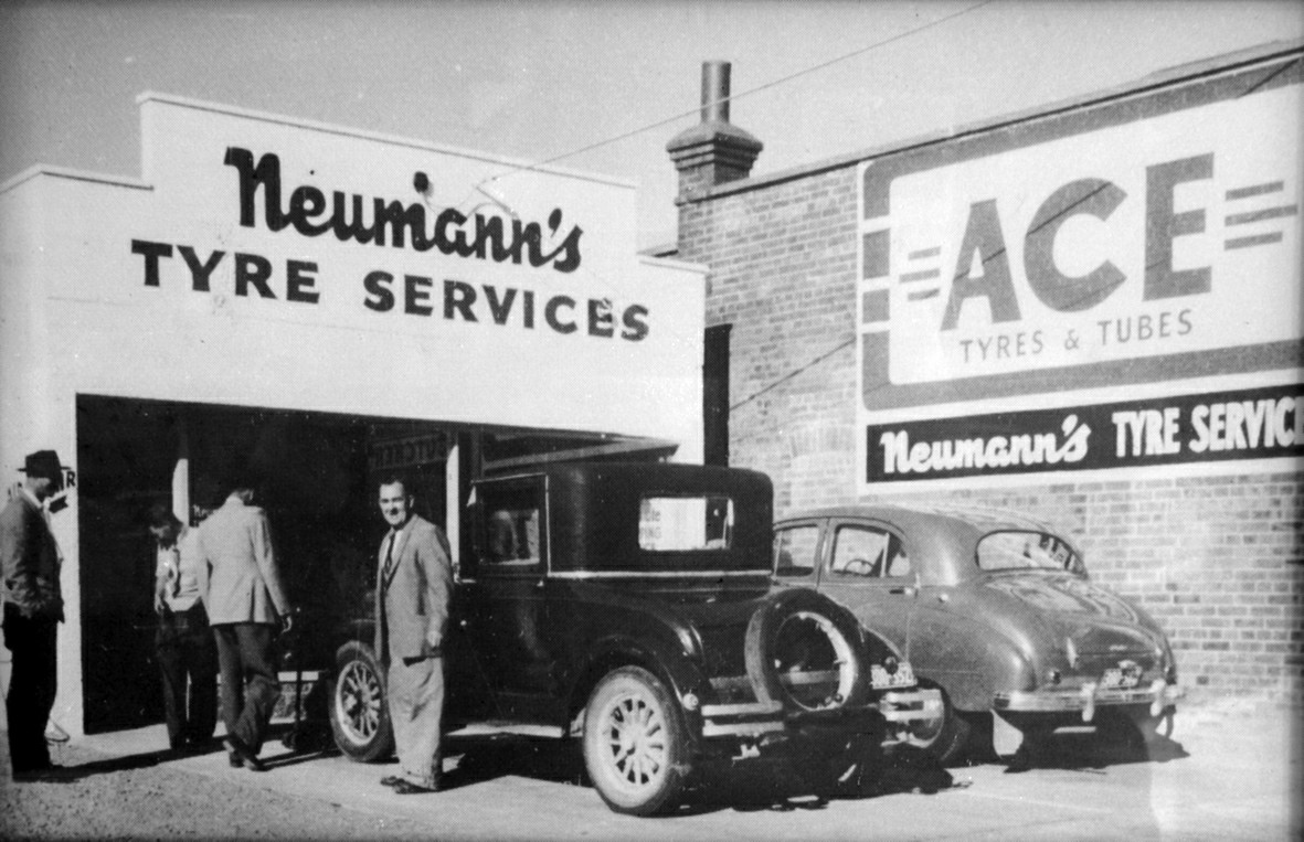 Black and White image of Neumanns Tyres workshop