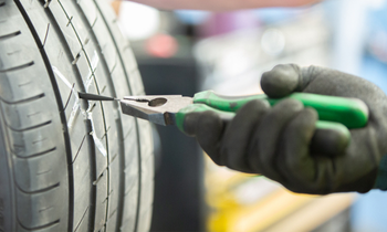 Puncture repairs pulling tyre plug